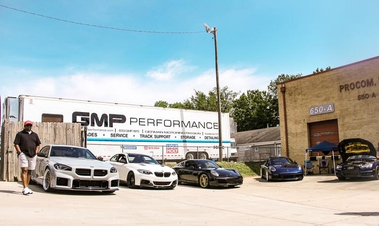 The GMP trailer and customer cars lined up for the 50th anniversary