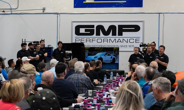 A club meet inside the South Atlanta shop under the GMP Performance sign
